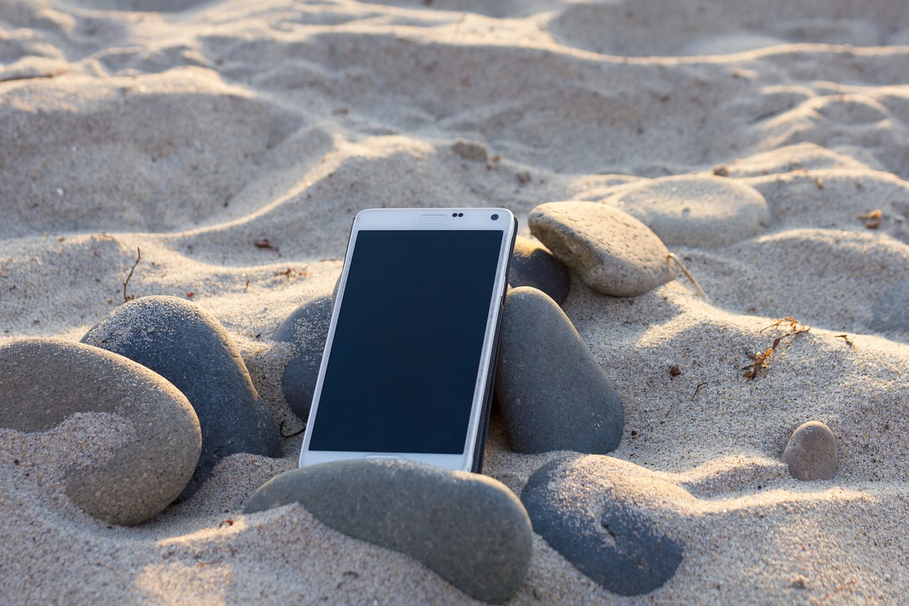smartphone in sand